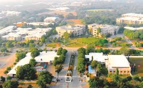 Aerial view of outdoor merchant facilities with modern buildings and greenery.