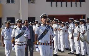 Group of disciplined police officers in uniform standing in formation outdoors.
