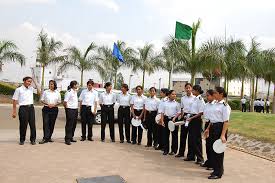 A group of professionals standing outdoors, dressed in formal white shirts, representing teamwork and leadership in business.
